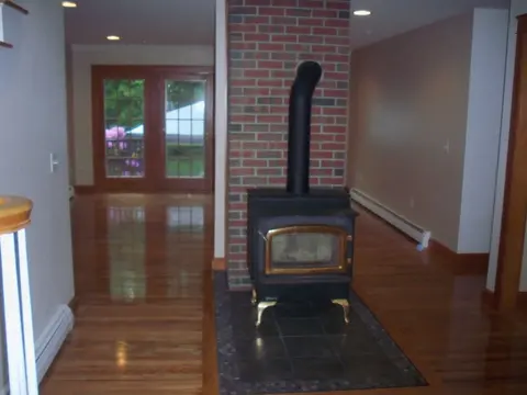 Garvey Construction, Wood stove & hardwood floor refinish